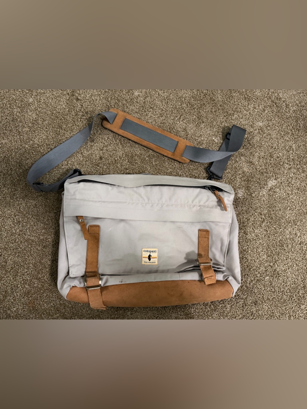 cotopaxi Light Gray Messenger Bag with Tan Suede Accents and Blue Strap